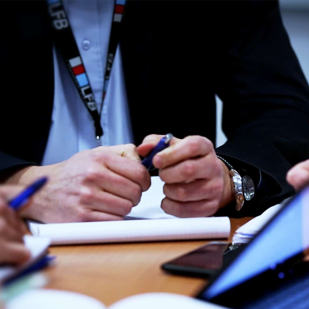 Hands' man with a pen